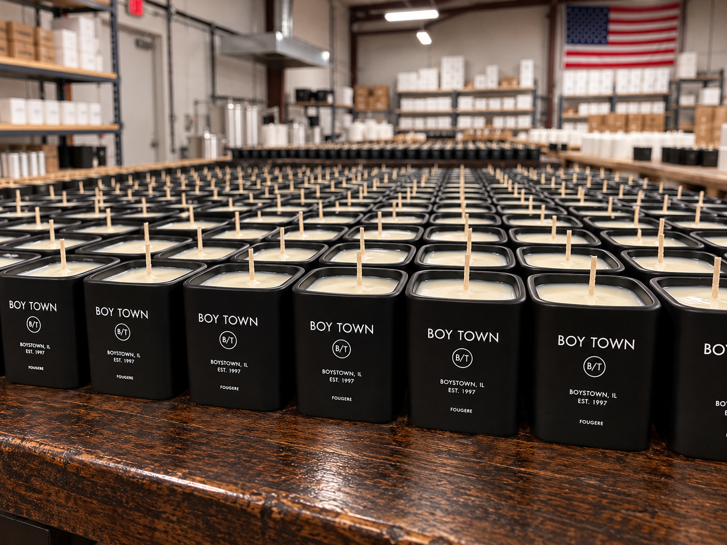 Freshly poured candles setting under the American flag in the workshop